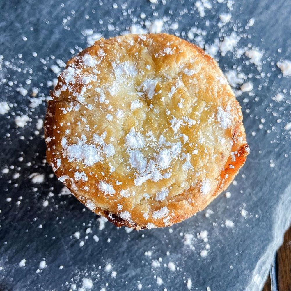 Mince pie, a British holiday dessert, sprinkled with powdered sugar.