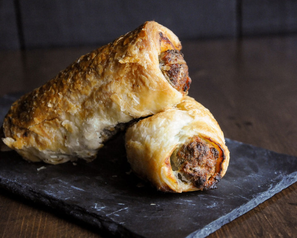 
                  
                    Two golden sausage rolls ready for eating
                  
                