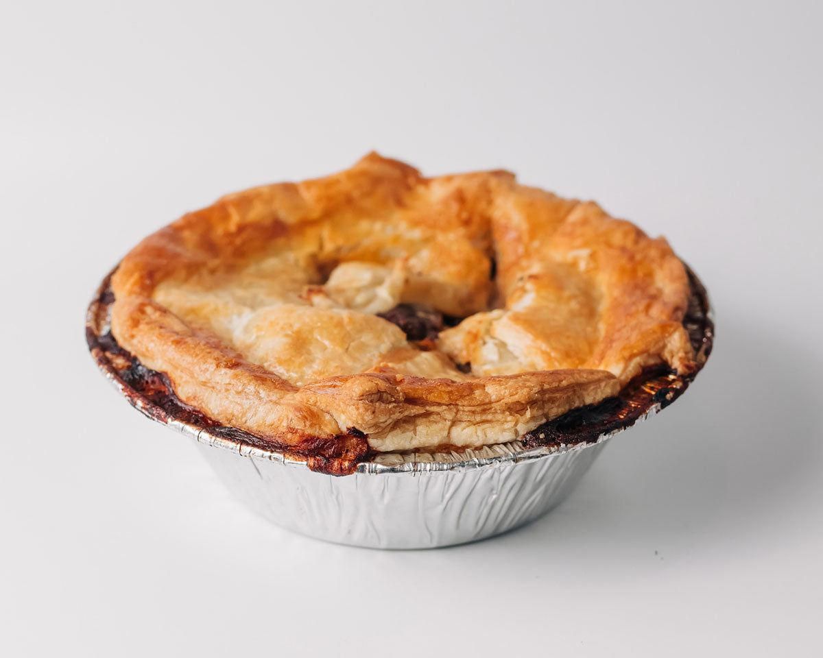 
                  
                    A golden creamy chicken pot pie ready for eating
                  
                