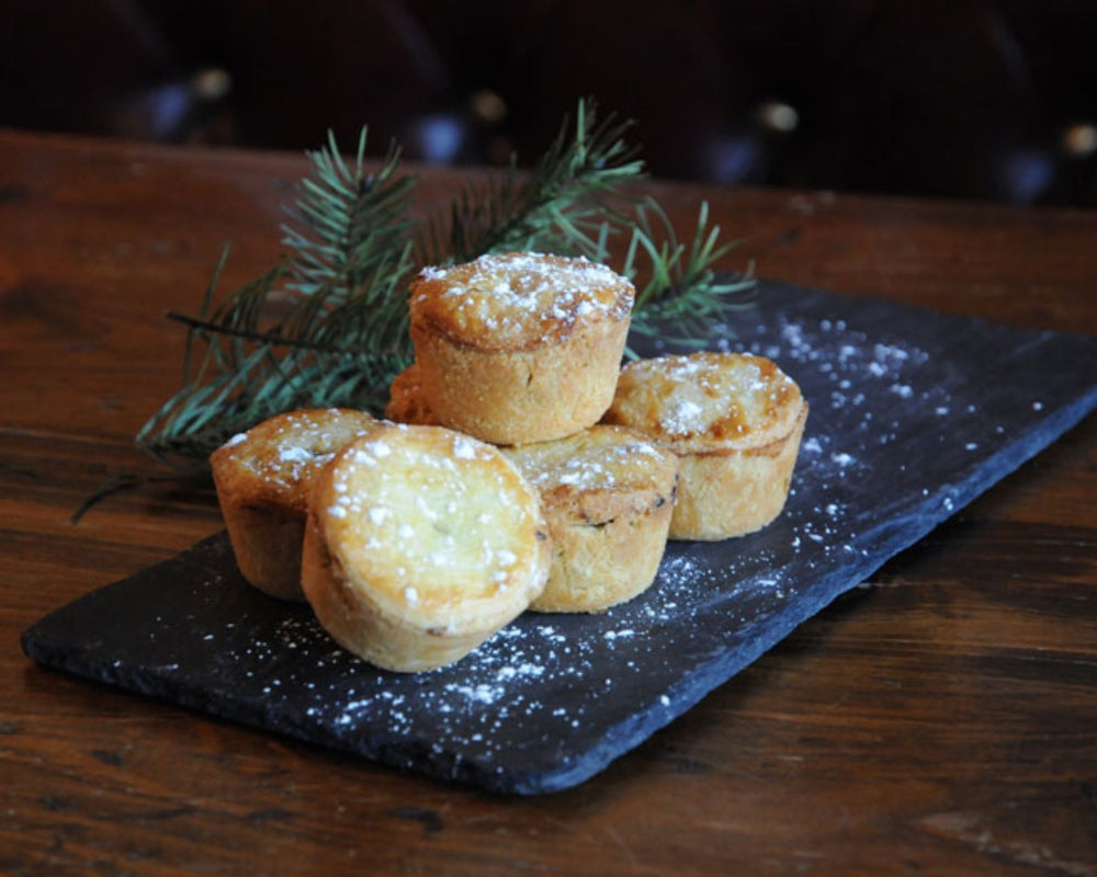 Gluten-free mince pies sprinkled with powdered sugar.